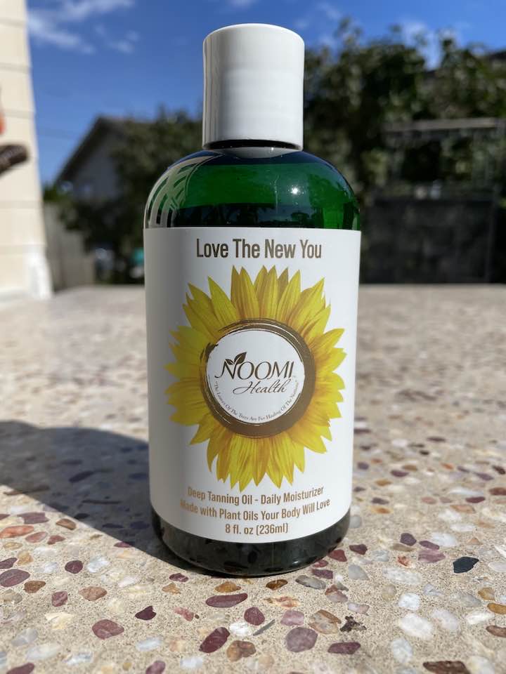 noomi health plant oils radiant skin deep tanning oil